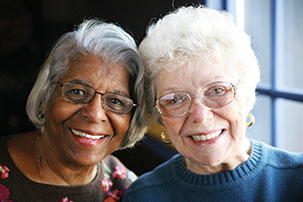 Two women smile together. Links to Over Age 70 Two women smile together. Links to Over Age 70
